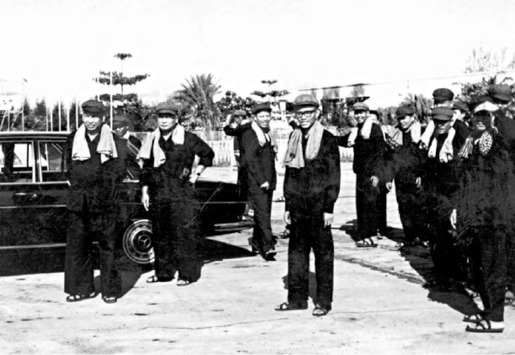 Cambodia: Khmer Rouge Leadership. Left to right: Pol Pot, Nuon Chea, Ieng Sary, Son Sen and Vorn Vet with senior cadre, probably at Pochentong Airport c. 1977.