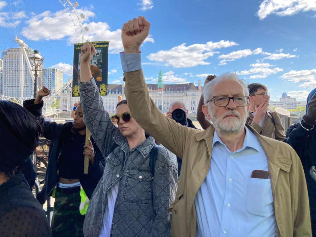 Corbyn raising a Communist fist at a demostration