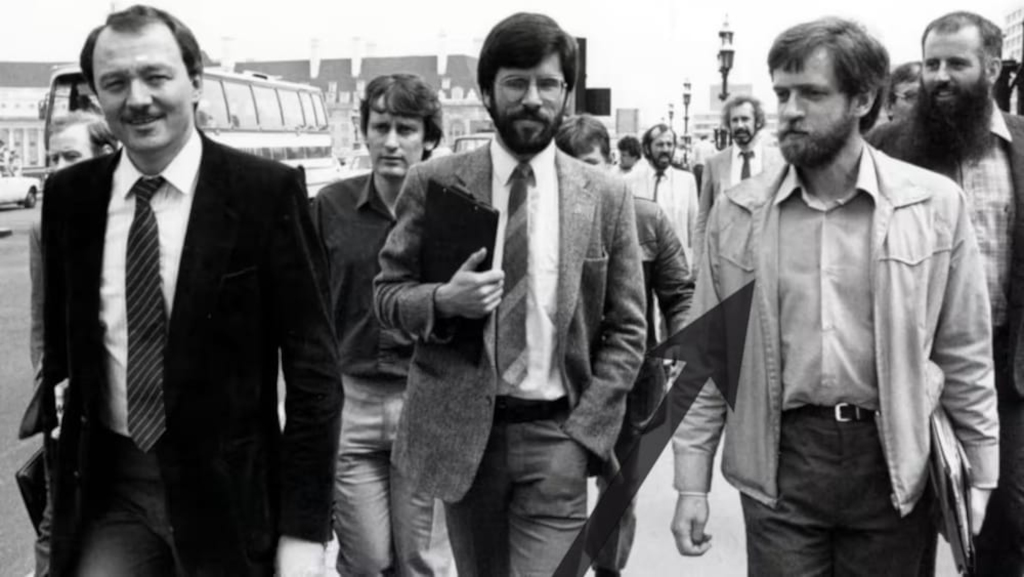 Corbyn walking with Gerry Admans and Martin McGuinness