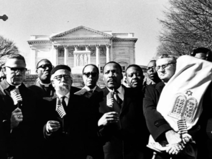 King and his henchmen pose for a group photograph back dropped by the White House